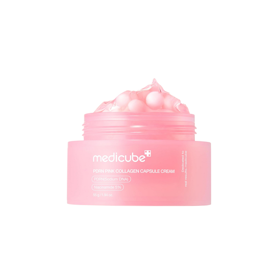MEDICUBE PDRN Pink Collagen Capsule Cream is a firming and brightening moisturizer designed to boost elasticity and restore radiance. Infused with Sodium DNA (PDRN), Collagen, and Peptides, it helps smooth fine lines and improve skin resilience. A blend of Niacinamide, Hyaluronic Acid, and Ceramide NP keeps the skin deeply hydrated and strengthens the barrier, while Glutathione enhances brightness. The innovative capsule texture melts into the skin for a soft, plump, and youthful finish.