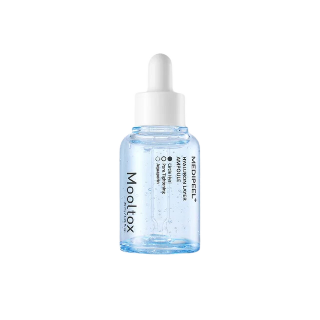 MEDIPEEL Hyaluronic Acid Layer Mooltox Ampoule is a deeply hydrating serum designed to replenish and lock in moisture. Infused with multiple types of Hyaluronic Acid, Collagen, and Ceramides, it provides intense hydration, improves elasticity, and enhances the skin’s moisture barrier. Enriched with Centella Asiatica, Eclipta Prostrata, and Rice Bran Oil, it soothes and revitalizes, leaving the skin plump, smooth, and radiant. Perfect for all skin types needing a boost of lasting hydration.