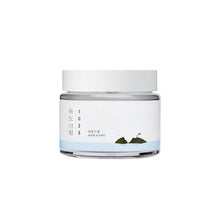 Load image into Gallery viewer, ROUND LAB 1025 Dokdo Cream is a rich, hydrating moisturizer designed to deeply nourish and protect the skin. It combines the power of Sea Water, Shea Butter, and Hyaluronic Acid to provide intense moisture and improve skin elasticity. Enriched with a complex of Ceramides (AP, AS, EOP, NP, NS), it strengthens the skin barrier, while Panthenol and Allantoin soothe and calm the skin. Ideal for all skin types, this cream helps achieve a smooth, hydrated, and healthy complexion.