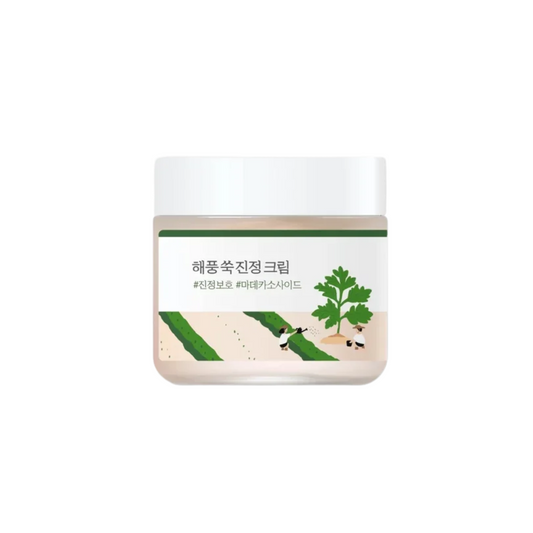 ROUND LAB Mugwort Calming Cream is a soothing and hydrating cream designed to calm sensitive and irritated skin. Formulated with Artemisia Vulgaris Extract (Mugwort) and Centella Asiatica Leaf Extract, this cream helps to reduce redness and inflammation while providing deep hydration. It also contains Madecassoside and Asiaticoside to further soothe and repair the skin barrier. Enriched with Panthenol and Allantoin, it offers additional calming benefits, leaving the skin soft, balanced, and comfortable. The