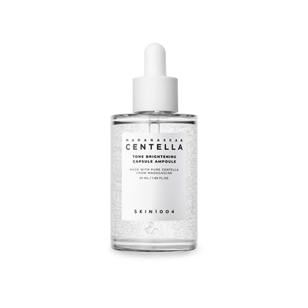 SKIN1004 Madagascar Centella Tone Brightening Capsule Ampoule is a lightweight yet powerful serum designed to brighten and even out skin tone. Formulated with Niacinamide, Tranexamic Acid, and Centella Asiatica Extract, it helps reduce dark spots, soothe irritation, and improve skin clarity. Enriched with Madecassoside and 3-O-Ethyl Ascorbic Acid (a stable form of Vitamin C), this ampoule hydrates and revitalizes tired skin while boosting its natural glow. Ideal for all skin types, it delivers a fresh and r