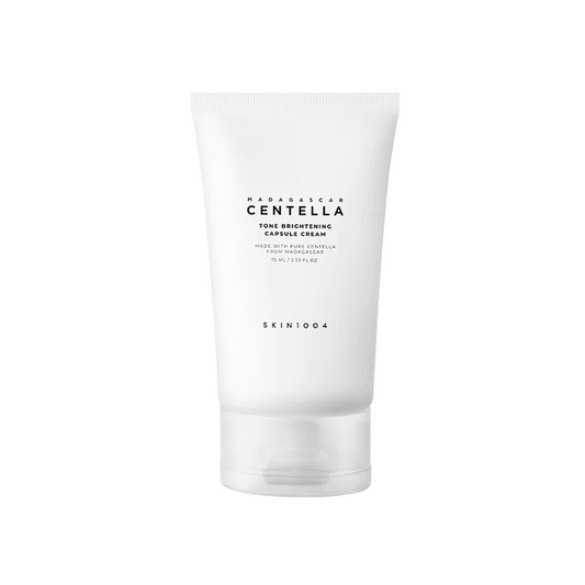 SKIN1004 Madagascar Centella Tone Brightening Capsule Cream is a lightweight moisturizing cream that hydrates, soothes, and brightens the skin. Formulated with Niacinamide, Tranexamic Acid, and Centella Asiatica Extract, it helps even out skin tone while calming irritation. With added Shea Butter, Squalane, and Hyaluronic Acid, this cream delivers lasting moisture and leaves the skin looking smooth, radiant, and refreshed.