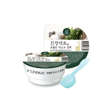 The LINDSAY Modeling Mask Cup Pack Calming Herb is designed to soothe and nourish the skin, featuring calming ingredients like Houttuynia Cordata and Mugwort extracts. Enriched with Green Tea, Centella Asiatica, and Aloe, this mask helps to reduce redness, hydrate, and rejuvenate tired skin. With a unique powder-to-gel formula, it forms a cooling, flexible layer on the face, allowing active ingredients to penetrate deeply while calming and refreshing your complexion. Ideal for sensitive and irritated skin.