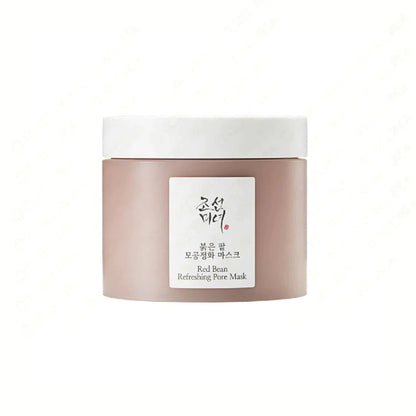 BEAUTY OF JOSEON Red Bean Refreshing Pore Mask is a purifying mask that deeply cleanses and refreshes the skin. Formulated with Red Bean Extract and Kaolin, it helps to absorb excess oil and unclog pores, leaving your skin smooth and refined. The mask also contains Pear and Strawberry Extracts to nourish and brighten the complexion, making it ideal for achieving a clear and refreshed look.