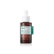 Load image into Gallery viewer, NEOGEN Real Vitamin C Serum is a brightening and hydrating serum formulated with 10% Sodium Ascorbyl Phosphate, a stable form of Vitamin C, to help improve skin tone and reduce the appearance of dark spots. Enriched with a blend of natural extracts, including Terminalia Ferdinandiana Fruit and Chicory Leaf, this serum nourishes and revitalizes the skin. The addition of Hyaluronic Acid and Vitamin E ensures deep hydration and antioxidant protection, leaving your skin looking radiant, smooth, and youthful. Id