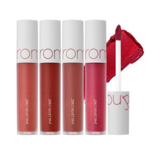 Load image into Gallery viewer, ROMAND Zero Velvet Tint offers a luxurious, velvet-matte finish that glides effortlessly onto the lips. This lip tint is crafted with a unique blend of silicone polymers and natural oils like Macadamia, Olive, Jojoba, and Grape Seed, which nourish and keep lips comfortable throughout the day. The richly pigmented formula provides smooth, opaque coverage that feels lightweight and lasts for hours without drying out the lips. Perfect for achieving a bold, sophisticated look with minimal effort.